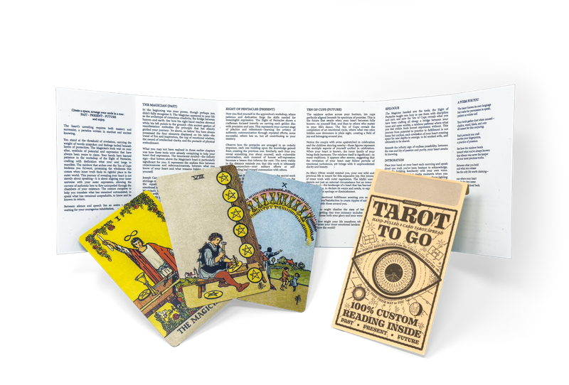 The contents — three tarot cards, the open reading booklet, and the sealed envelope